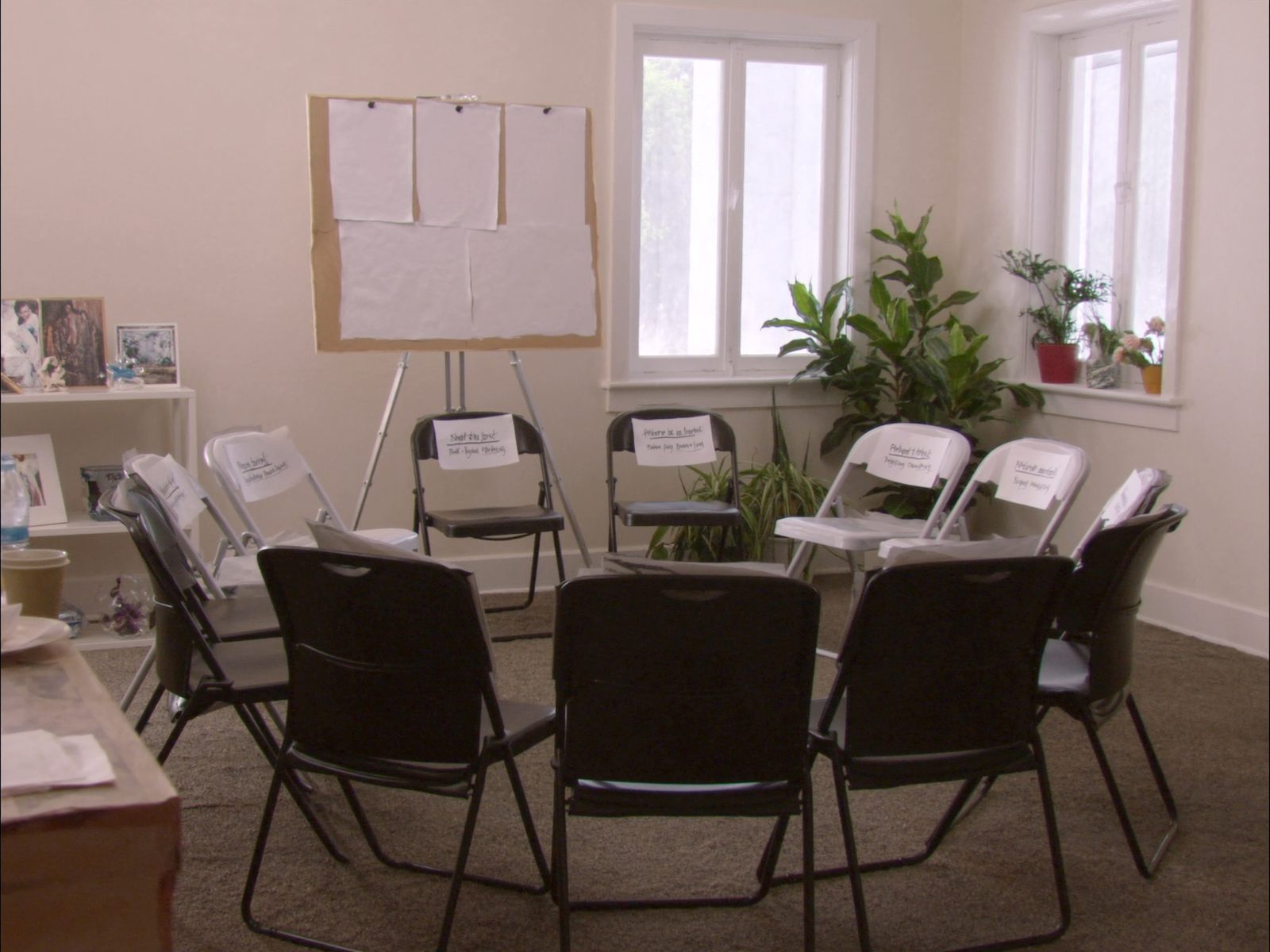 A bright workshop room with chairs in a circle