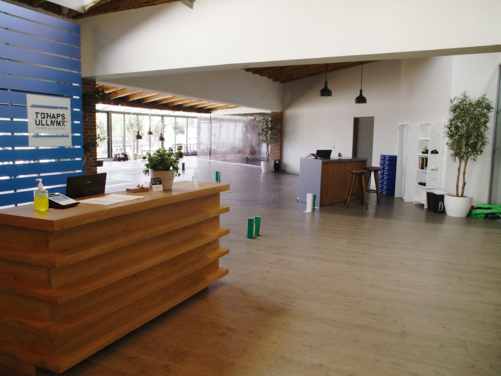 A gym front desk and member lounge