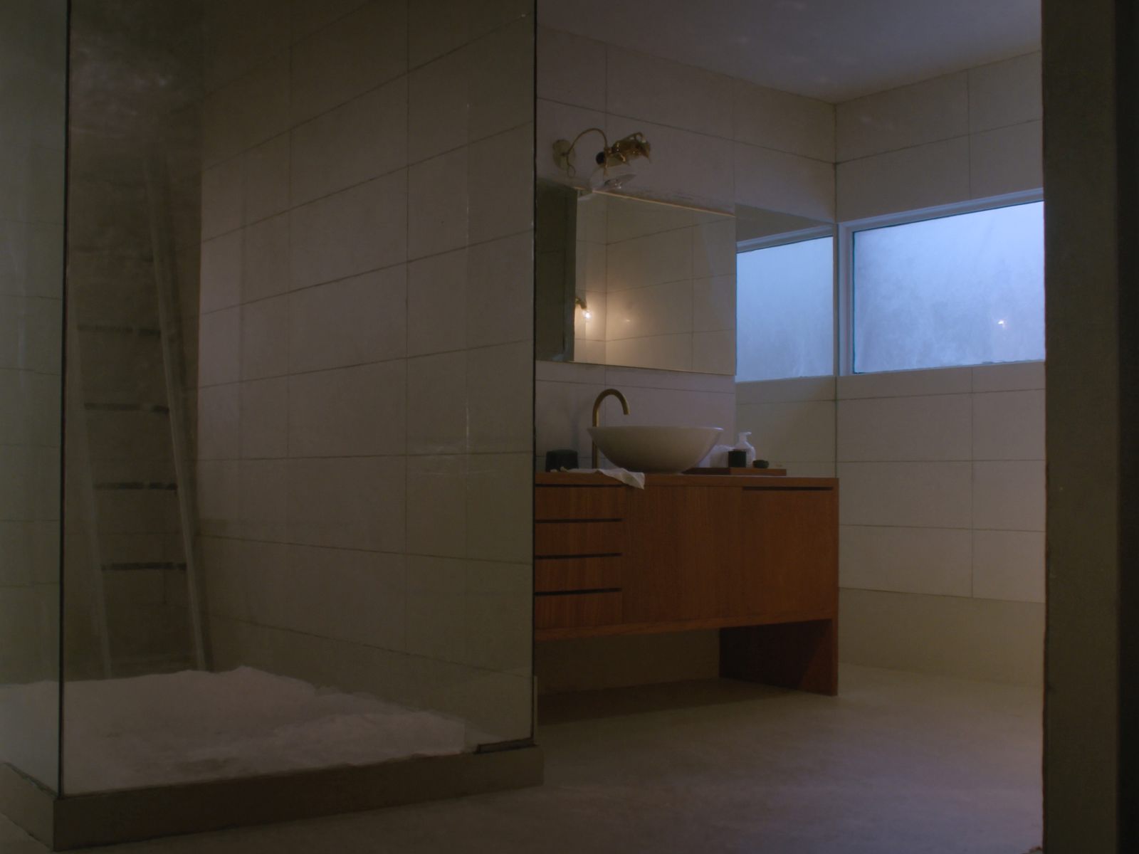 A freshly remodeled bathroom with a glass shower