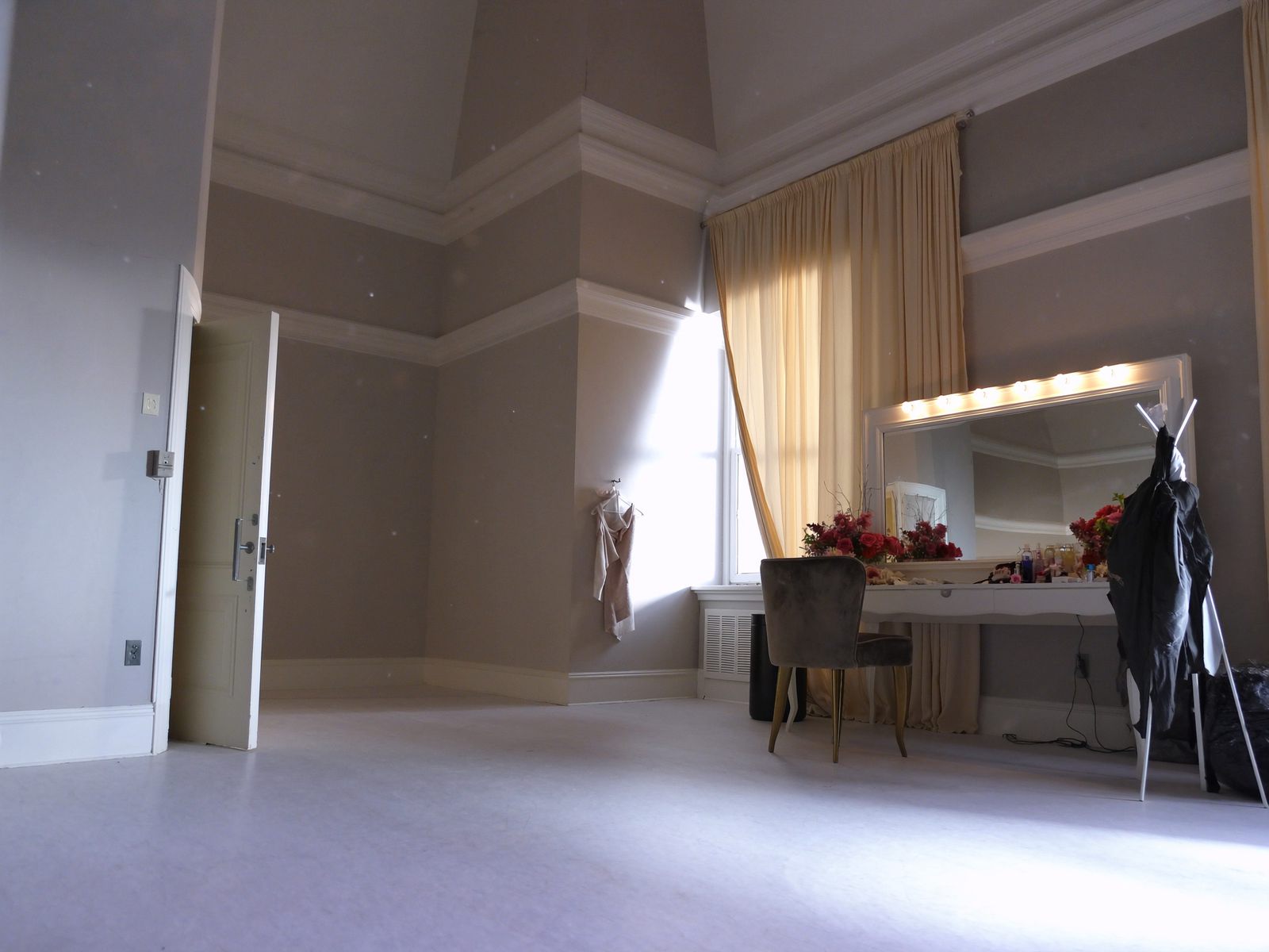 A bright bridal getting-ready suite with a large mirror
